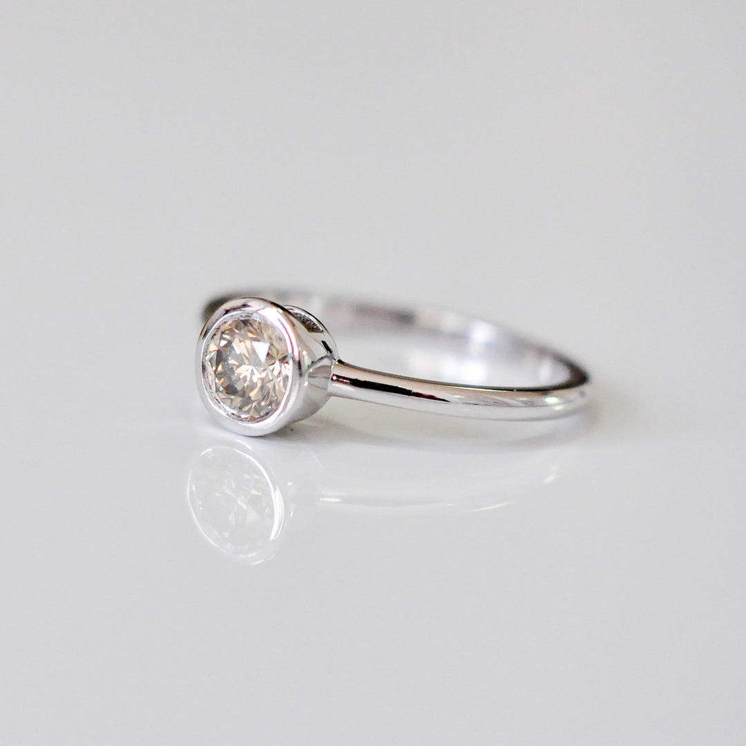delicate bezel setting 0.5 carat diamond solitaire ring