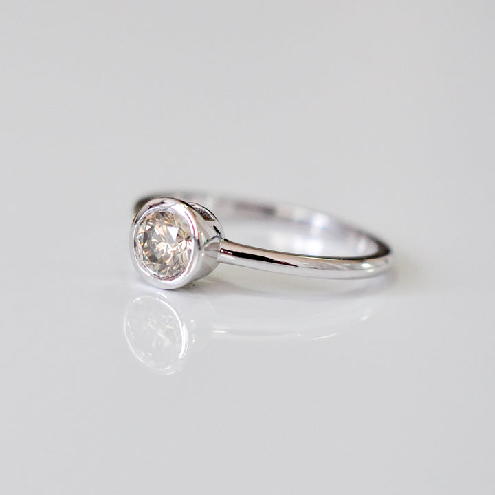 delicate bezel setting 0.5 carat diamond solitaire ring