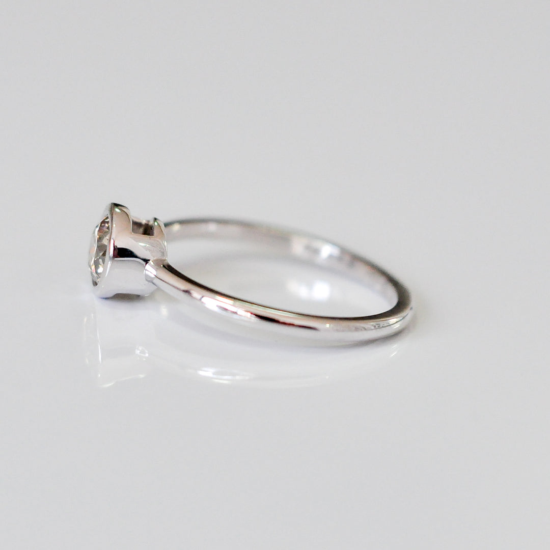 delicate bezel setting 0.5 carat diamond solitaire ring