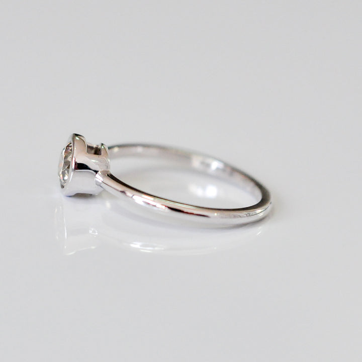 delicate bezel setting 0.5 carat diamond solitaire ring