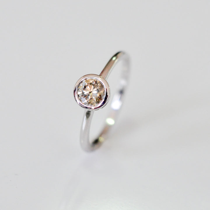delicate bezel setting 0.5 carat diamond solitaire ring