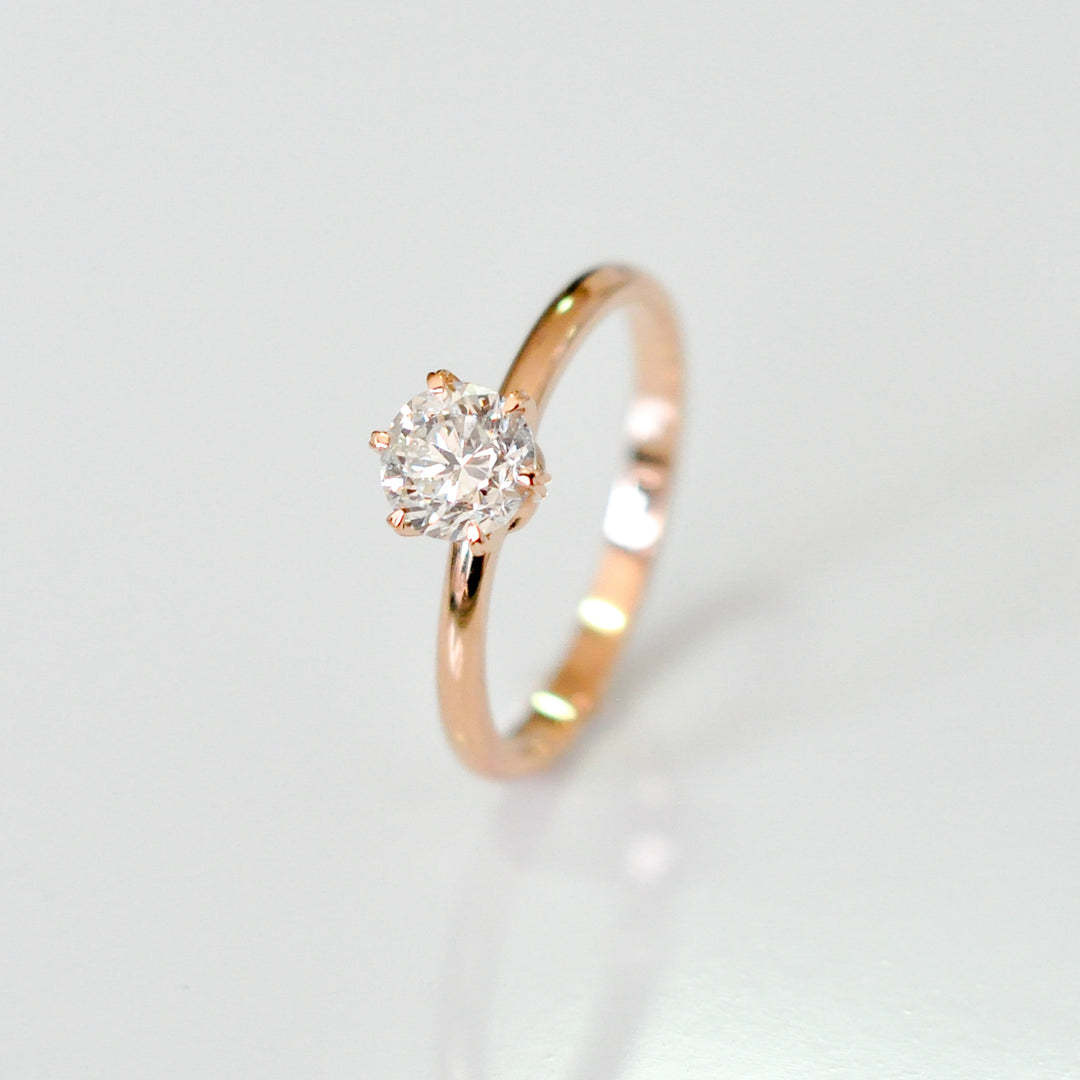 white diamond with rose gold engagement ring