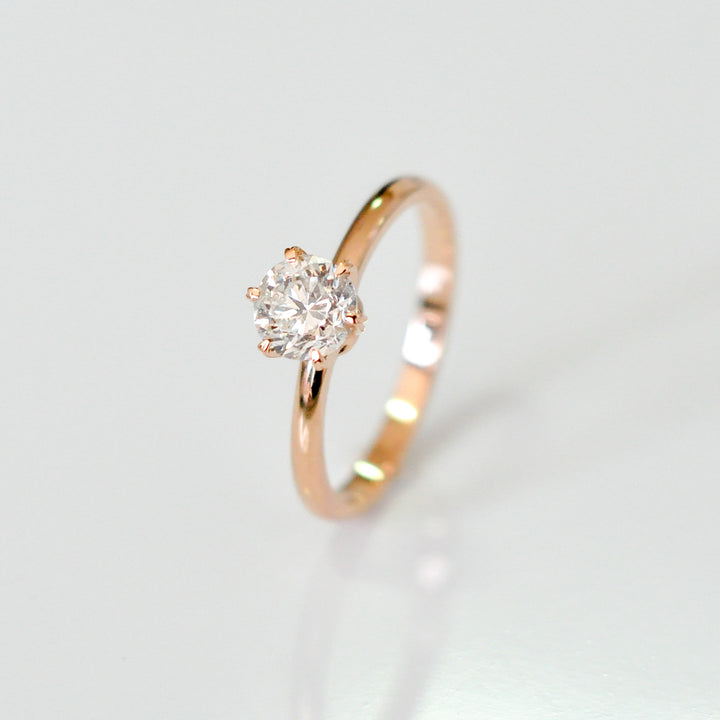 white diamond with rose gold engagement ring