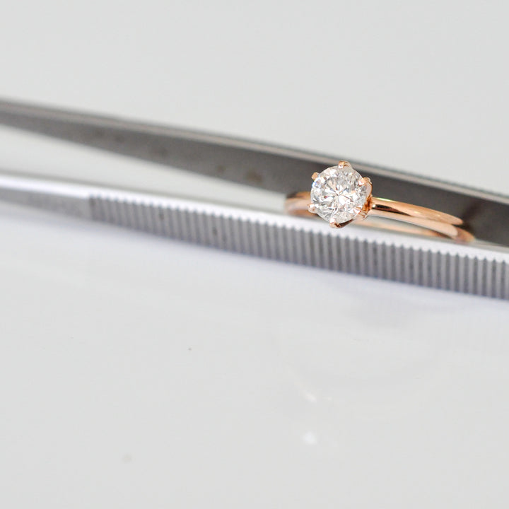 white diamond with rose gold engagement ring