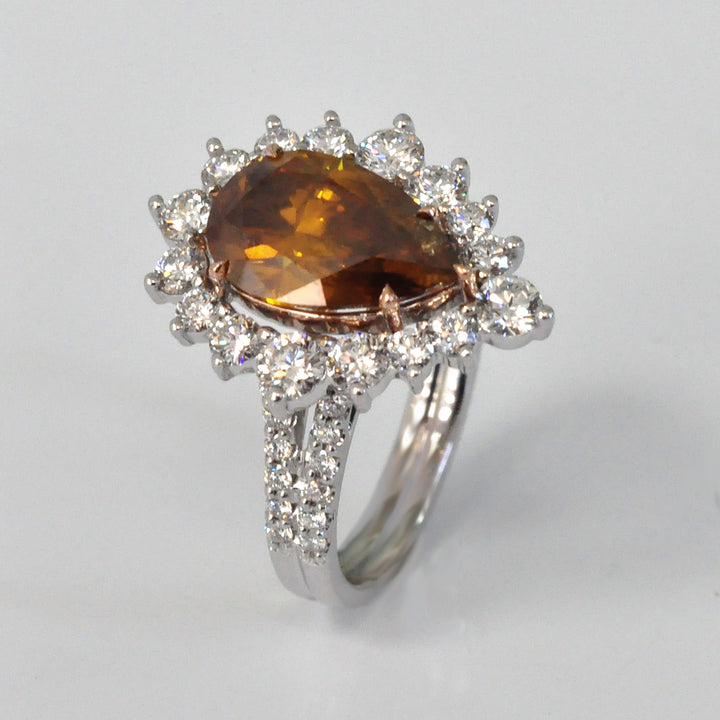 Pear shape fancy orangy brown diamond halo ring