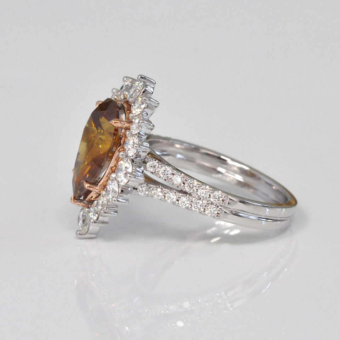 Pear shape fancy orangy brown diamond halo ring