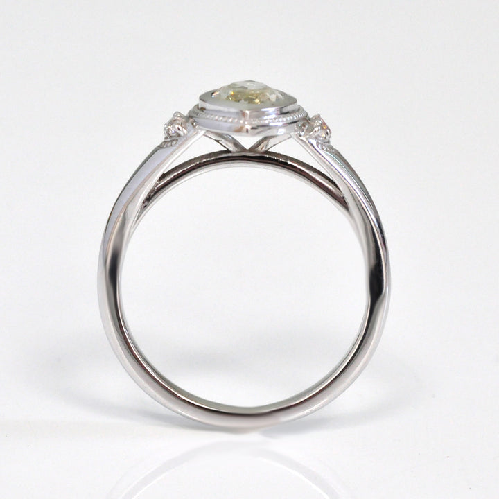white gold bezel set marquise center diamond ring