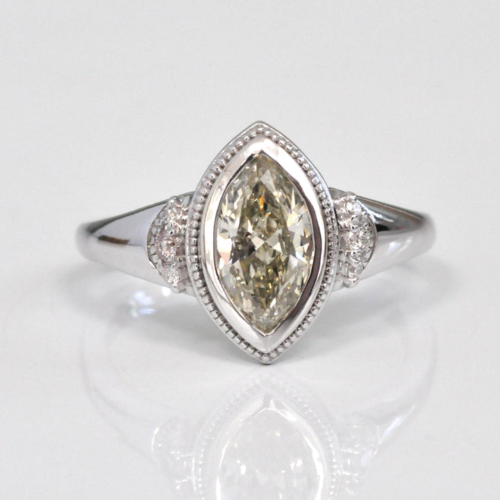 white gold bezel set marquise center diamond ring