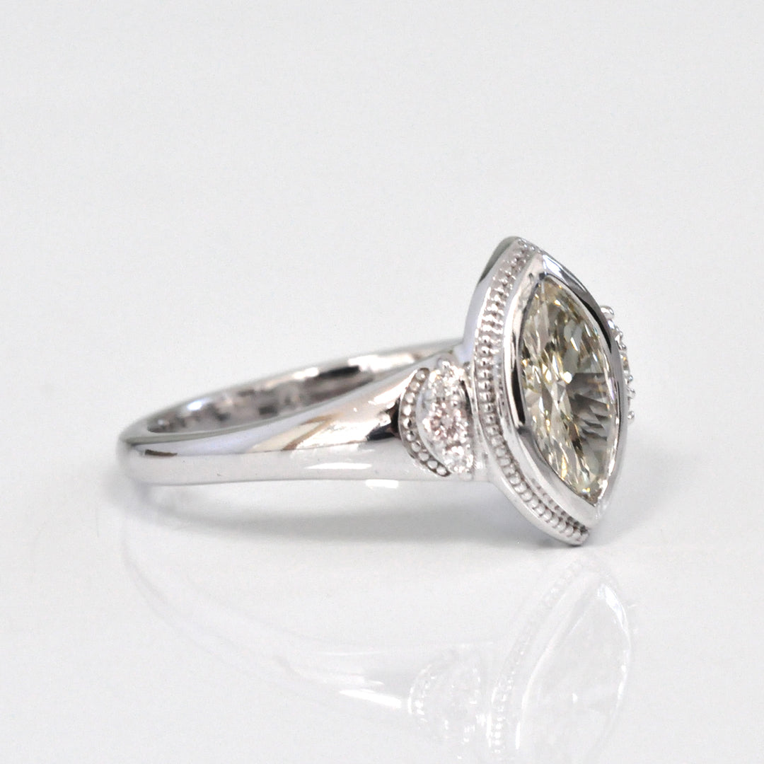 white gold bezel set marquise center diamond ring