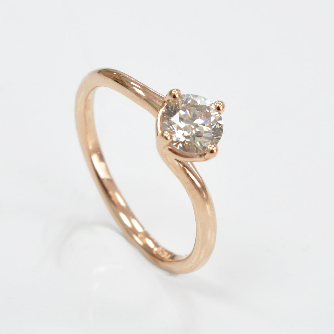 0.62 carat diamond rose gold solitaire engagement ring