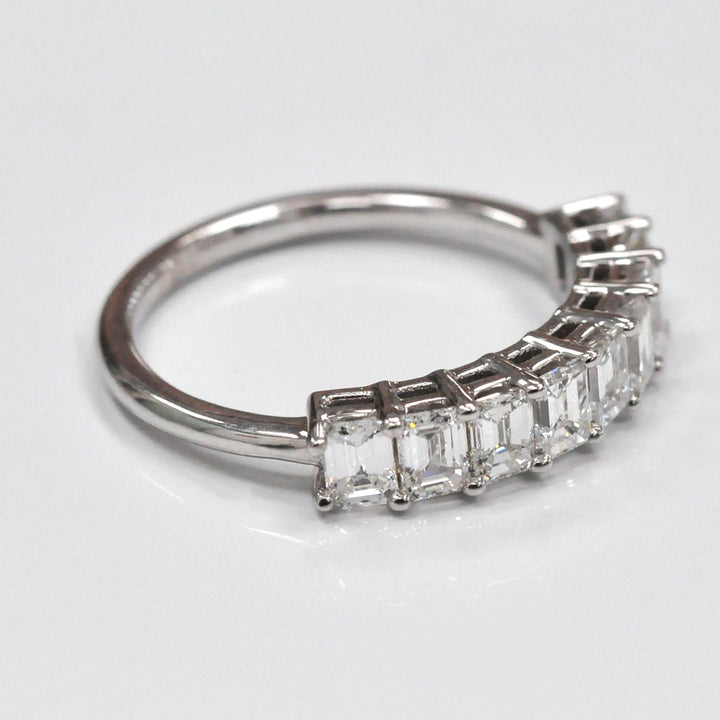Nine baguette diamonds half eternity ring.