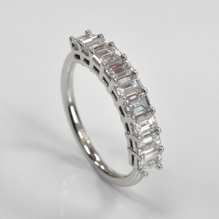 Nine baguette diamonds half eternity ring.
